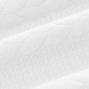 Detailopname van de verfijnde jacquard honingraattextuur van de witte sweatshirtstof