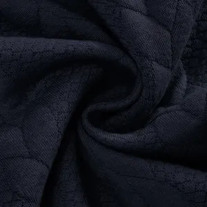 Macroweergave van de zware marineblauwe jacquardstoftextuur voor herensweatshirts