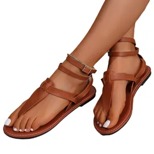 Stylish brown flat gladiator sandals with toe-post and multi-strap ankle buckle closure