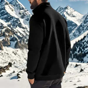 Back view of a men's black zip-up fleece sweatshirt in a snowy mountain setting.