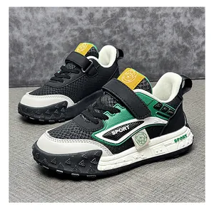 Detail view of children's sports shoes showing leather and mesh texture with sport logo