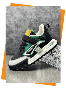 Close-up of kids' stylish green and black athletic sneakers with Velcro strap design