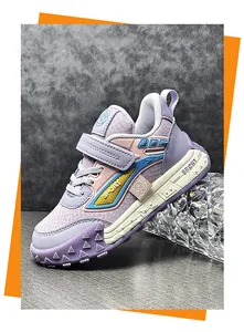 Close-up of stylish purple children's sneakers with durable leather finish and sport design.