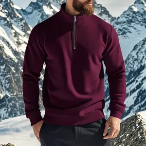 Detailed view of a premium men's burgundy quarter-zip sweatshirt with a stand collar