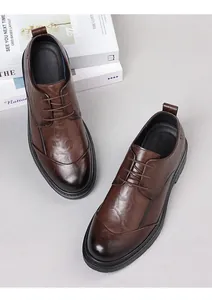 Top-down view of brown hand-textured leather business dress shoes for men