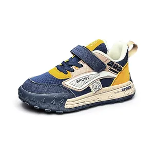 Fashionable children's sports sneakers with durable leather upper in navy and yellow