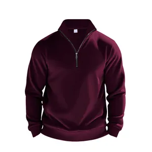 Close-up detail of maroon men's quarter-zip fleece sweatshirt with stand collar design