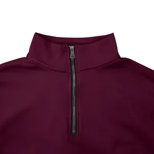 Close-up detail of a men's maroon quarter-zip sweatshirt with high collar texture