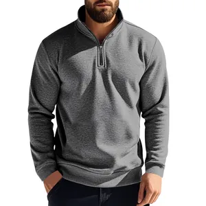 Close-up detail of a men's grey quarter-zip sweatshirt featuring a warm standing collar