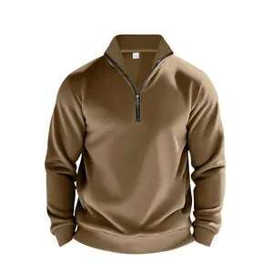 Close-up detail of a men's khaki quarter-zip sweatshirt featuring a stand collar