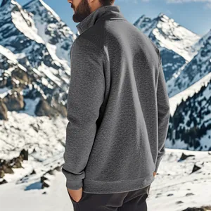 Back view of a grey fleece-lined zip-up sweatshirt in a snowy mountain setting