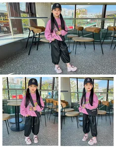 Full-body lifestyle view of a young girl wearing pink cartoon sneakers and winter outfit