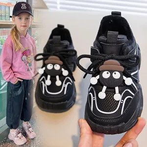 Cozy fleece-lined black sneakers for girls featuring a cute cartoon soot sprite detail
