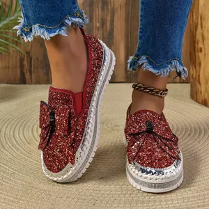 Elegant women's sparkling red sequin flat loafers featuring a stylish bow decoration