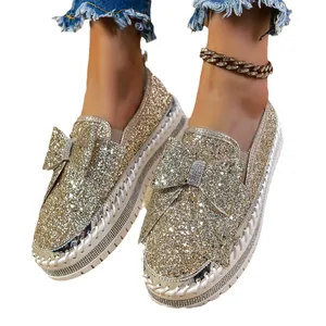 Trendy gold sequin flat shoes for women with elegant decorative bow and rhinestone detail