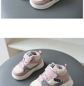 Detail view of children's pink winter sneakers with warm fleece lining and quilted design.
