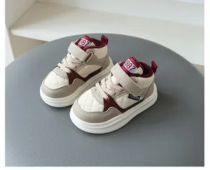 Close-up of beige and maroon quilted children's fleece-lined sneakers with Velcro straps