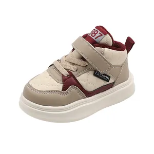Close-up of children's warm quilted sneakers with red plush lining and Velcro strap.