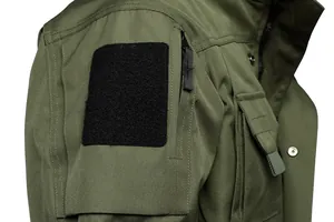 Detail of tactical jacket sleeve pocket with velcro patch area and zipper closure