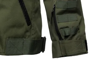 Detail view of army green tactical jacket sleeve with zippers and MOLLE webbing.