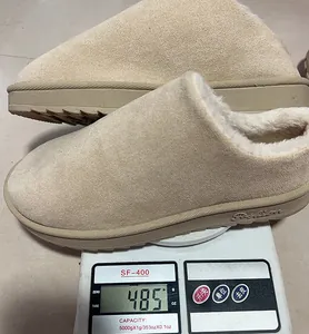 Detailed weight measurement showing 485g for beige fur-lined platform winter slippers