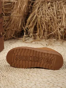 Detailed macro view of the non-slip rubber sole for these women's winter snow boots