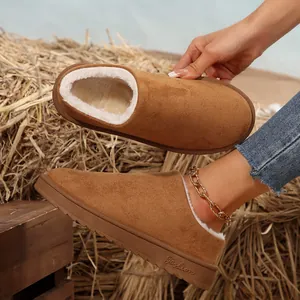 Detailed view of women's warm brown snow boots with plush faux fur lining