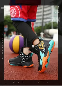 High-top basketball shoes for boys with non-slip soles on a red outdoor court.