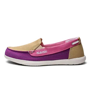 Side view of colorful canvas men's walking shoe with pink, purple and beige panels