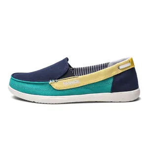 Detailed side view of men's multi-color canvas slip-on loafers in blue and teal