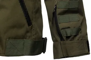 Close-up of tactical jacket featuring military webbing, heavy-duty zippers and durable fabric