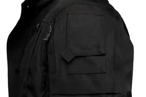 Macro view of durable black tactical jacket showing sleeve pocket and zipper details