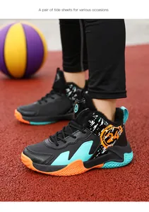 Close-up of children's basketball shoe with orange and turquoise accents on court