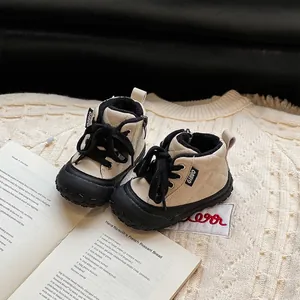 Cream quilted toddler boots with soft soles and side zippers for baby boys and girls