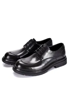 Detailed side view of black leather round-toe men's dress shoes with chunky soles