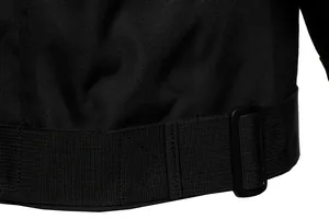 Detailed view of the durable scratch-resistant tactical jacket fabric with adjustable hem buckle