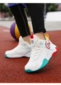 Detailed shot of white kids basketball sneakers with warm lining and 24 logo on court