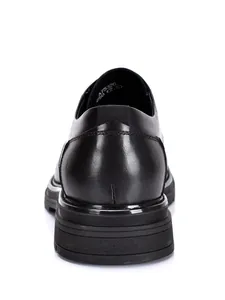 Detailed back view of premium black leather men's business dress shoes with round toe
