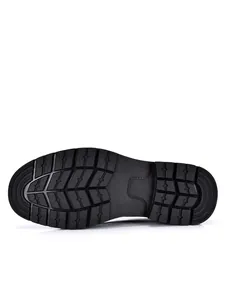Close-up macro detail of the durable non-slip rubber outsole on men's leather shoes