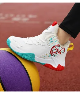 Close-up of boys' winter basketball training shoe with warm fleece lining on basketball