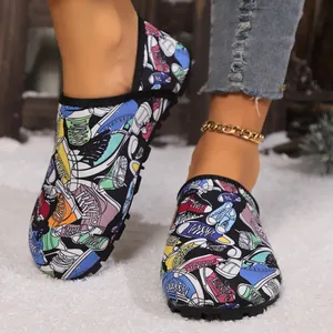 Macro detail of winter indoor thermal shoes with colorful sneaker print on a snow surface