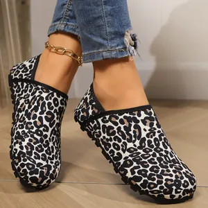 Close-up of stylish leopard print warm home shoes with soft soles for yoga and lounging