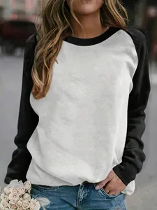 Casual women's raglan long sleeve shirt with black and white color block design
