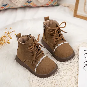 Classic brown girls' leather boots with delicate white lace trim and side zipper