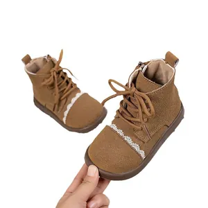 Brown leather girls boots with lace trim and soft sole for autumn and winter wear.