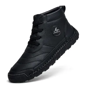 Detail view of black leather high-top boot with textured grain and hand-stitched sole