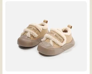 Close-up detail of beige toddler winter walking shoes featuring warm fleece lining and strap