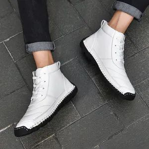 Close-up detail of white high-top leather boots with exquisite manual stitching for men