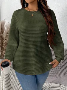 Detail view of women's olive green quilted sweatshirt with square waffle texture