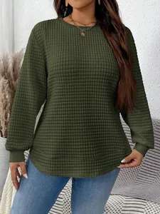 Detail view of dark olive green long sleeve sweatshirt with quilted square grid texture